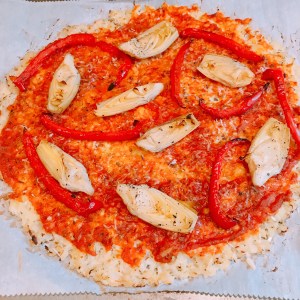 baked cauliflower crust with artichoke &amp; red peppers